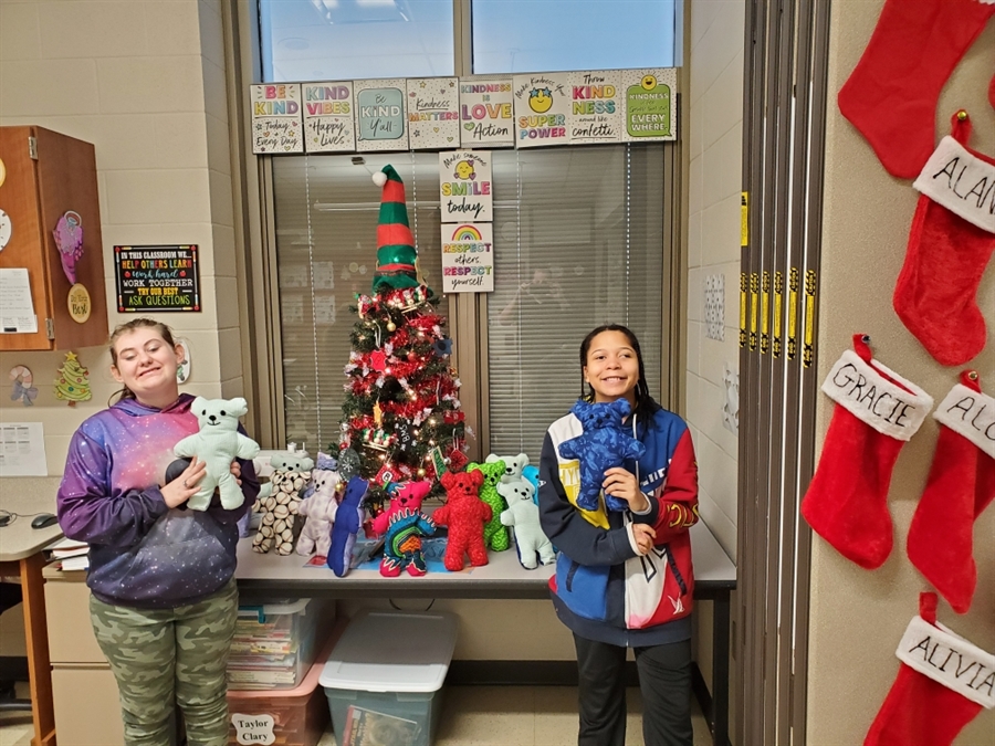 Students and the bears they made for Dolls of Hope.